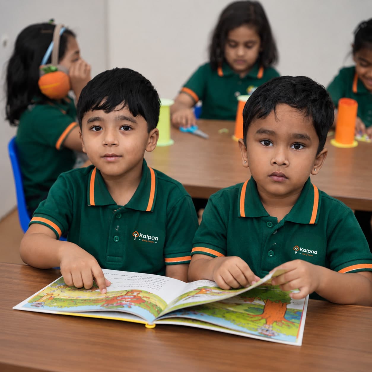 Two children sharing a picture book